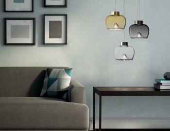 Modern interior, biege sofa, frames and a table